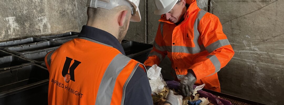 Alfred H Knight employee sorting waste at waste sorting facility