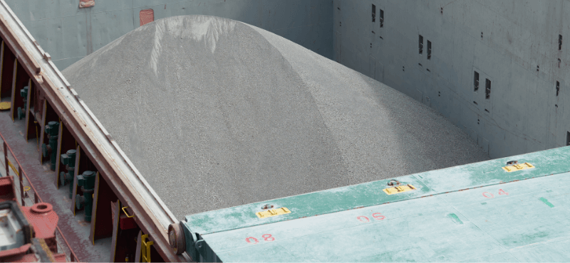 Images of commodities in a bulk cargo ship container, and operations at a mine site